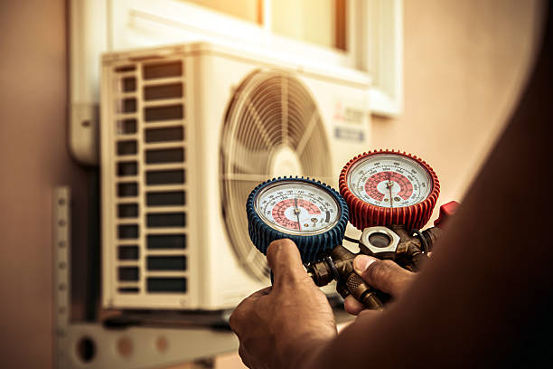 Professional Air Conditioning Service technician working in Nesbit, MS